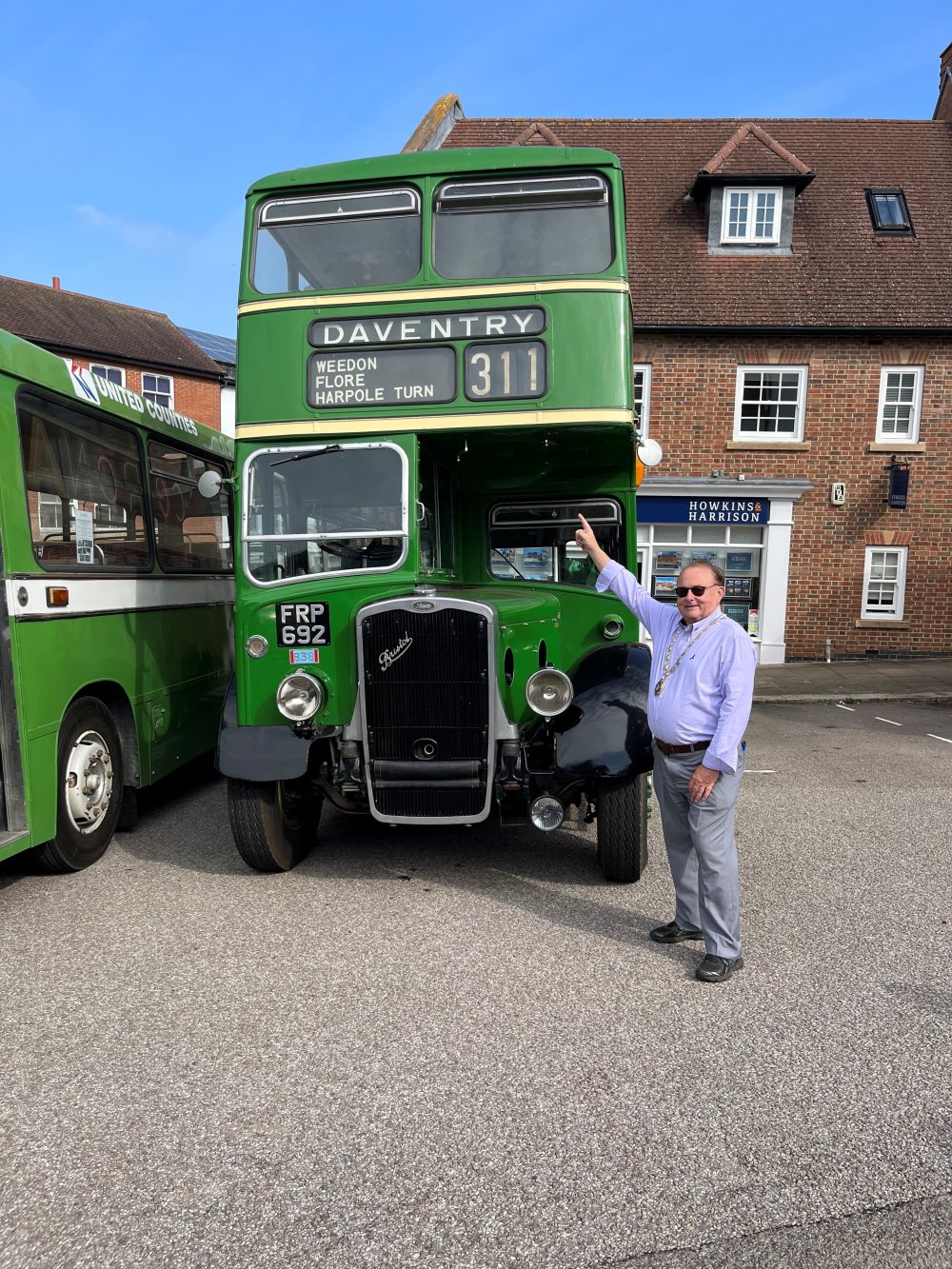 Mayor of Daventry Ted Nicoll infront of no. 311 bus